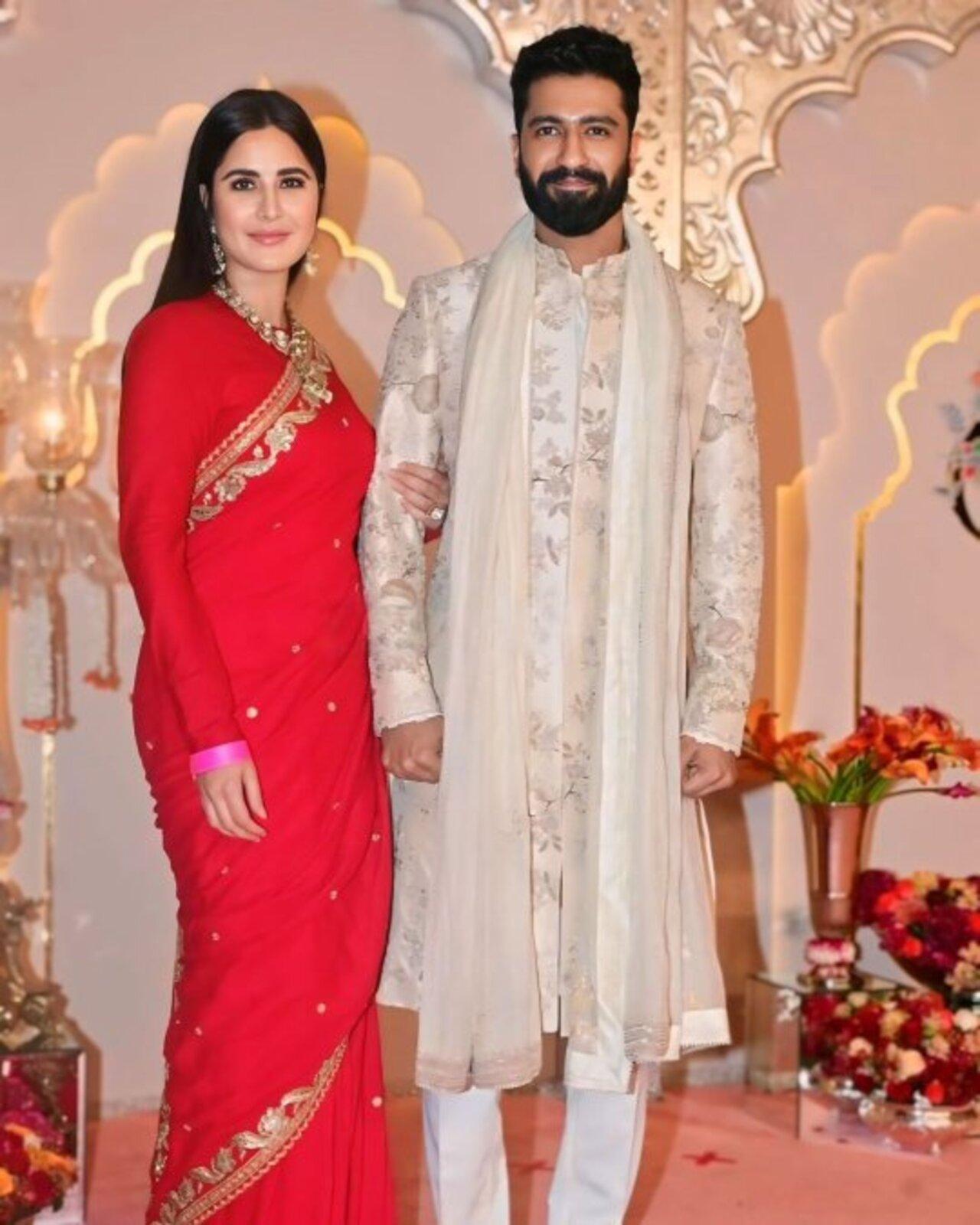 Katrina Kaif looks mesmerising in this bright red saree with a delicate buti motif and an intricate border with gold floral embroidery. What made her drape stand out was the full-sleeved solid red blouse with a closed round neckline. She chose exquisite polki jewels for accessories. This look is perfect for reception as it exudes grace.